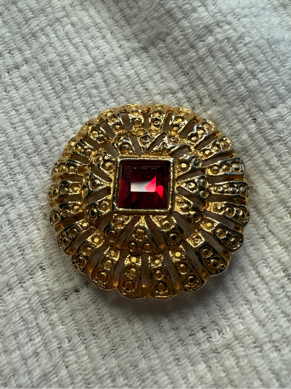 Medieval Romantic Style 1970s Goldtone Brooch with a Ruby Red Stone